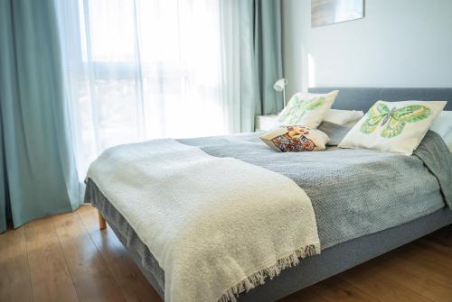Postel nebo postele na pokoji v ubytování APARTAMENT SłONECZNY