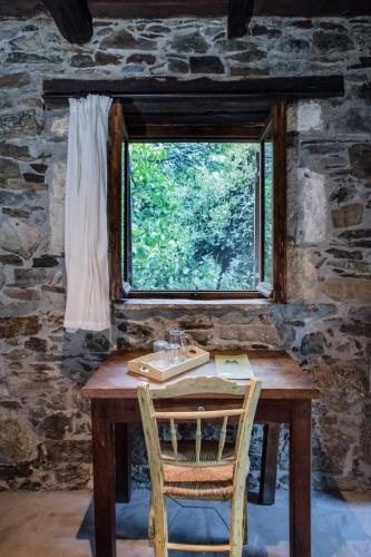 a wooden table with a sink and a window at Μilia Mountain retreat in Vlátos