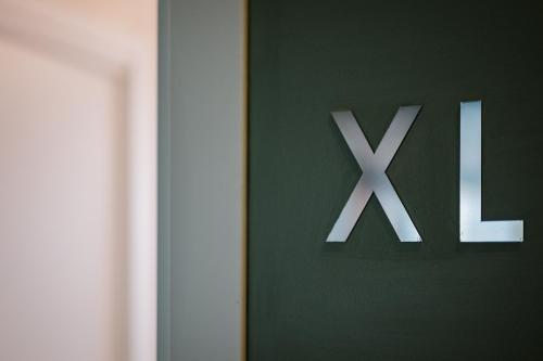 a close up of a sign that says xxx at La Risacca Relais in Belvedere Marittimo