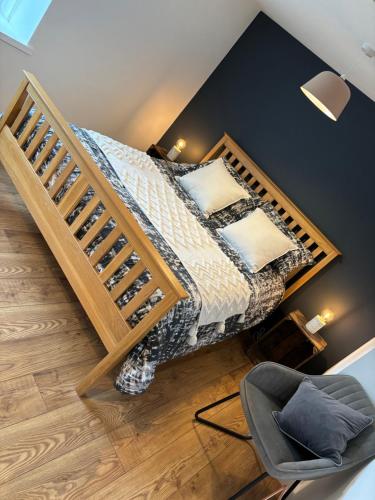 a bedroom with a bunk bed with a chair at Pretty little cottage in the peaks in Hadfield