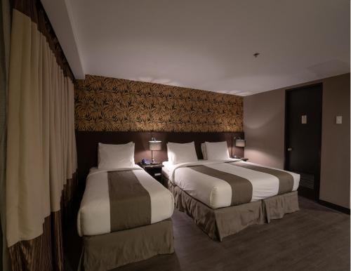 Cama o camas de una habitación en GT Hotel Jaro