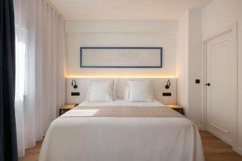 Letto o letti in una camera di Hotel Rovira
