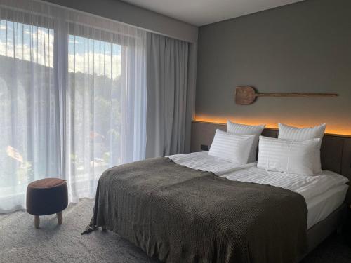 Letto o letti in una camera di Balvanyos Resort - Peakture Hotel & Grand Hotel Balvanyos