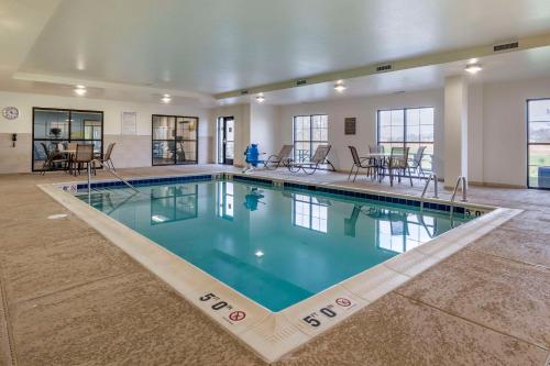 a large pool with blue water in a building at Comfort Suites Manheim - Lancaster in Manheim