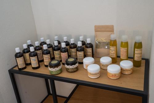 a group of bottles of alcohol on a shelf at Apartma in wellness Čista fantazija in Velika Polana