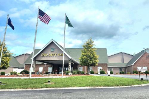 a building with two flags in front of it at Quality Inn Dublin I-81 in Dublin