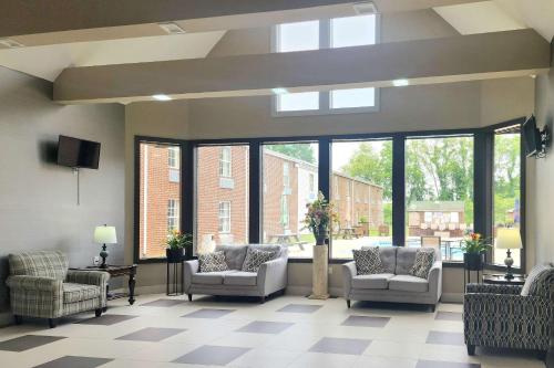 a large waiting room with chairs and windows at Quality Inn Dublin I-81 in Dublin