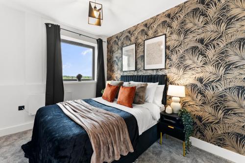 a bedroom with a large bed and a large window at Stylish Two-Bedroom Flat in Norwich in Norwich