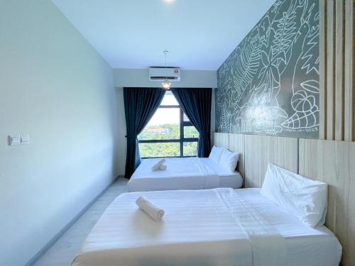 En eller flere senge i et værelse på ENDLESS SUMMER Jesselton Quay Kota Kinabalu 來繕旅遊