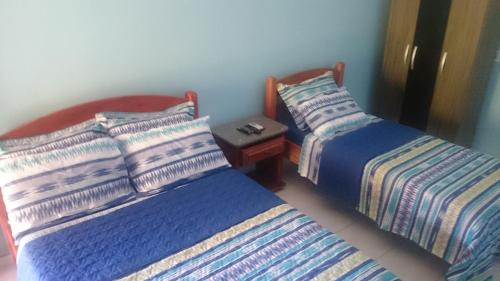 Ένα ή περισσότερα κρεβάτια σε δωμάτιο στο Pousada Maré
