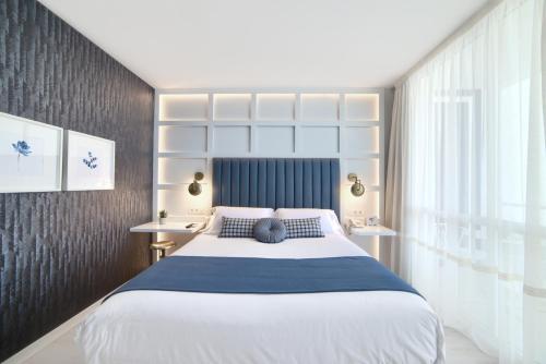 Ένα ή περισσότερα κρεβάτια σε δωμάτιο στο Hotel Luze El Villa