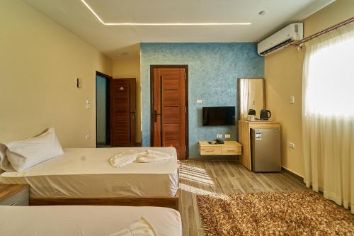 TV a/nebo společenská místnost v ubytování New Gardenia Pyramids Hotel