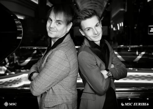 two men standing next to each other with their arms crossed at "Chez Ba'Nus" in Blankenberge