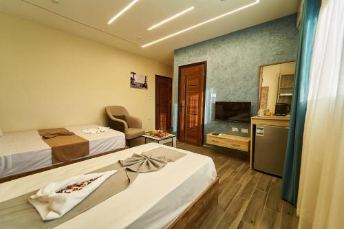 TV a/nebo společenská místnost v ubytování New Gardenia Pyramids Hotel