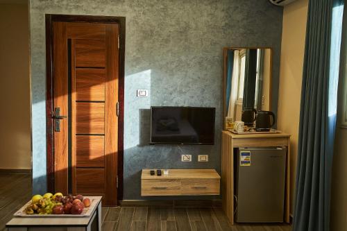 Kuchyň nebo kuchyňský kout v ubytování New Gardenia Pyramids Hotel