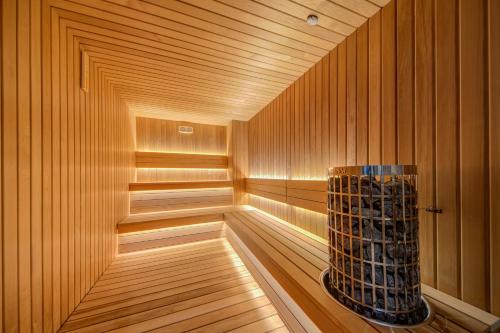 a sauna with a bottle of wine in it at Noru Hotel Malta - Adults Only Hotel in St Julian's