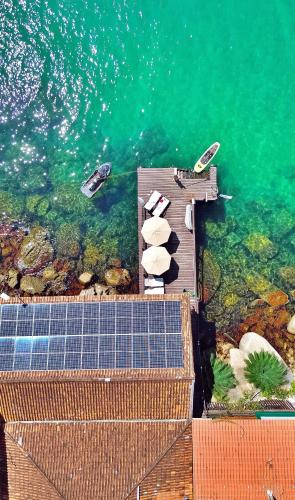 an aerial view of a dock with boats in the water at Pousada Convés - Ilha Grande in Praia de Araçatiba