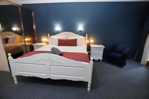Ένα ή περισσότερα κρεβάτια σε δωμάτιο στο Sleepy Hill Motor Inn