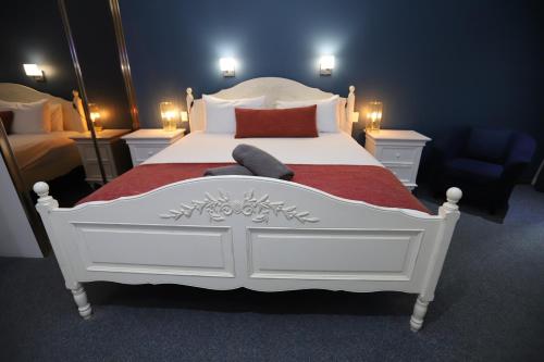 Ένα ή περισσότερα κρεβάτια σε δωμάτιο στο Sleepy Hill Motor Inn