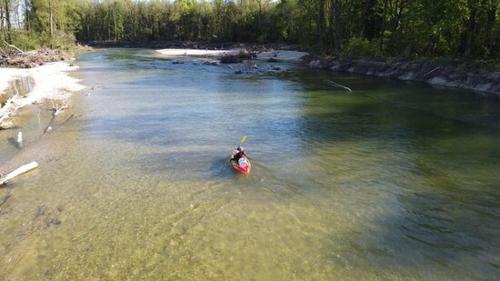 a person in a red kayak in the water at Chez Odette et Ricardo Meximieux - Pérouges in Meximieux