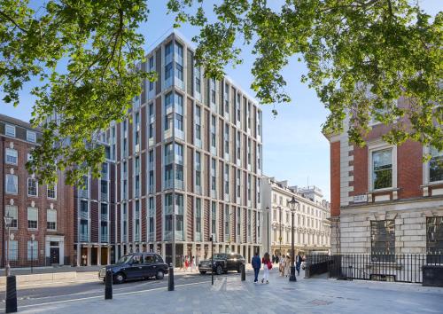 a rendering of a tall building on a city street at Mandarin Oriental Mayfair, London in London