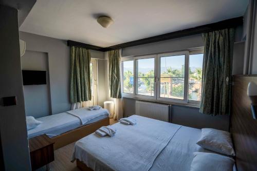 Imagen de la galería de Kutlugun Sahil Otel, en Akçay