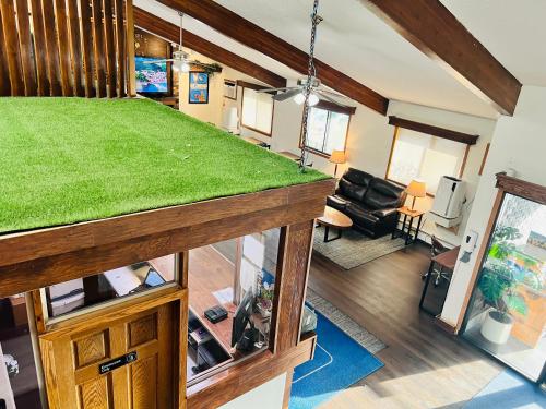 a living room with a greengrass counter in a house at Travelodge by Wyndham Valleyfair Shakopee in Shakopee