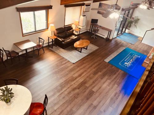 an overhead view of a living room with a couch and a table at Travelodge by Wyndham Valleyfair Shakopee in Shakopee