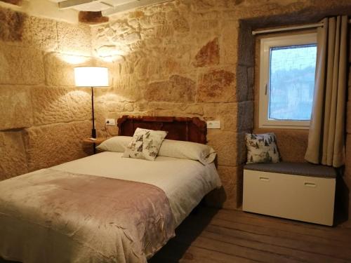 Ένα ή περισσότερα κρεβάτια σε δωμάτιο στο Casa Carradas