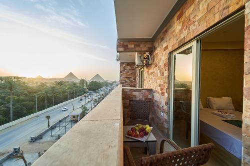 Balkón nebo terasa v ubytování New Gardenia Pyramids Hotel