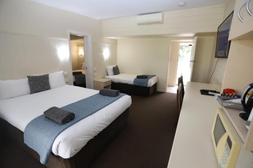 Ένα ή περισσότερα κρεβάτια σε δωμάτιο στο Sleepy Hill Motor Inn