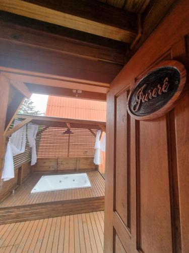 a small sauna with a sign on the door at Chalés Ilha da Mata Pousada in Florianópolis