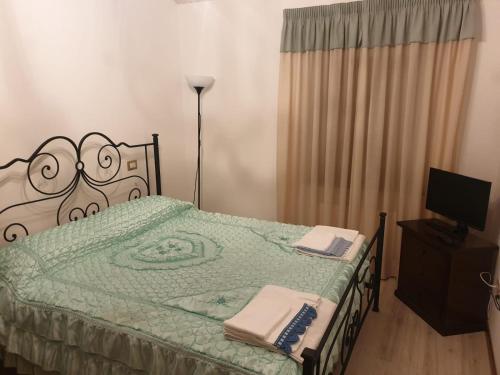 a bedroom with a bed with a face drawn on it at Resort Restaurant Villa Berta in San Severino Marche