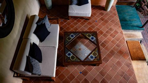 an overhead view of a room with a couch and a table at Sama Retreats - Kosgoda in Kosgoda