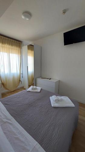 Postel nebo postele na pokoji v ubytování Vinsea Hotel