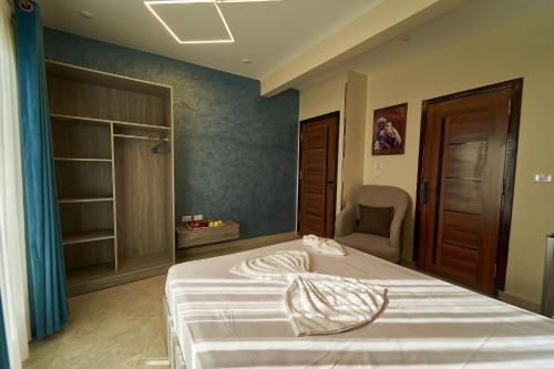 Postel nebo postele na pokoji v ubytování New Gardenia Pyramids Hotel