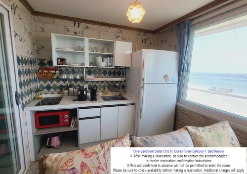 Kuchyň nebo kuchyňský kout v ubytování Seaside Pension