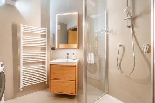 a bathroom with a sink and a shower at Casa Clara, old town experience in Riva del Garda