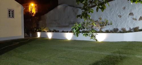 a garden at night with lights on the grass at Villa in Sintra - Casa da Penha Ferrim in Sintra