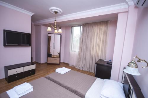 Postel nebo postele na pokoji v ubytování Hotel ''Premium Palace''