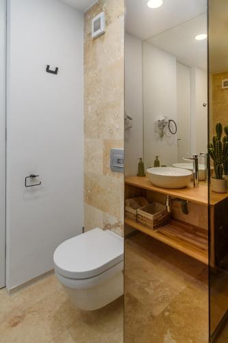 a bathroom with a toilet and a sink at Astria Eclipse - Complex Novum in Olimp