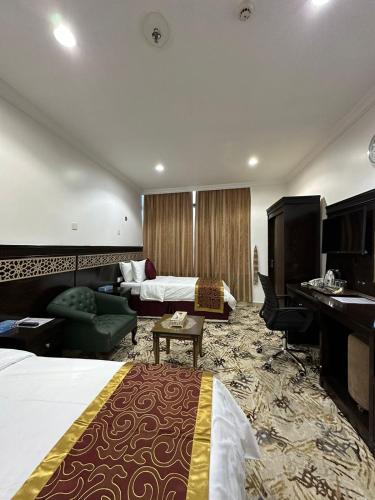 Cama o camas de una habitación en Nuzha Sqaure Hotel