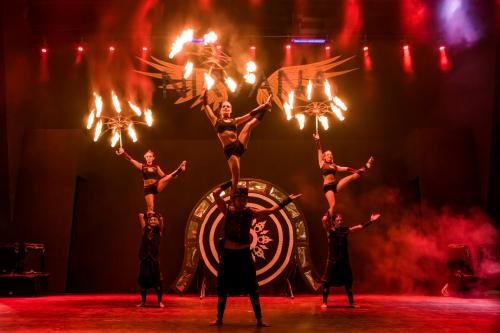 a group of performers on a stage with lights at Nirvana Mediterranean Excellence - Ultra All Inclusive in Beldibi