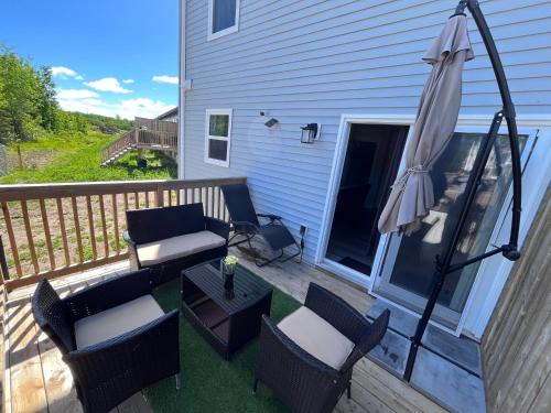 A balcony or terrace at Modern Vac Home, private Hot tub, close to airport, Dieppe, Moncton