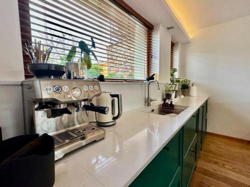 a kitchen with a coffee maker on a counter at Hello Balaton in Alsóörs