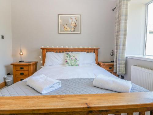 En eller flere senge i et værelse på Maryland Cottage