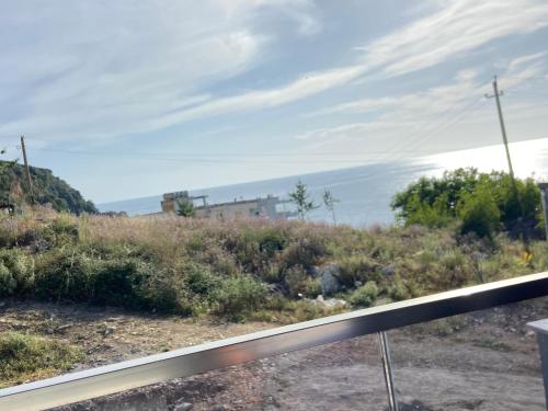 a view of a hill with a house in the distance at Villa Bodini Himare in Himare