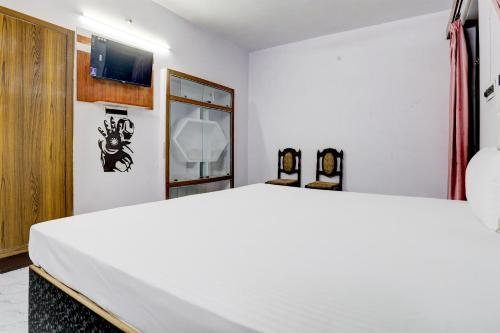 Posteľ alebo postele v izbe v ubytovaní OYO Hotel Star Galaxy
