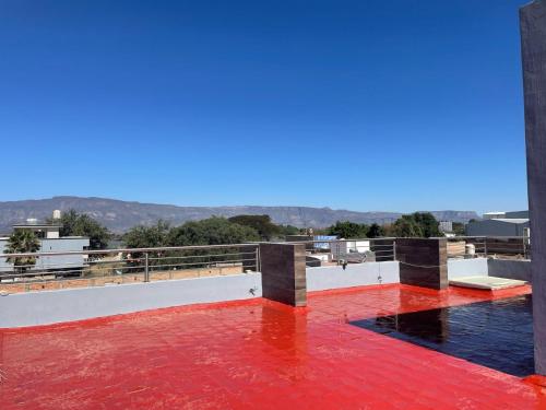 a view from the roof of a building with a red floor at Casa Samu in Tequila