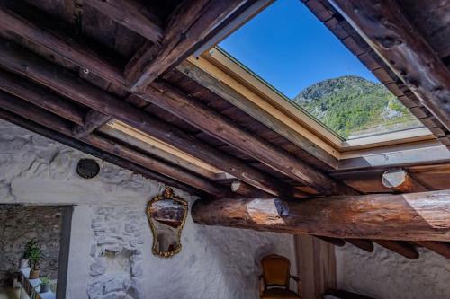 a skylight in a room with a wooden ceiling at Secluded home in Le Caunil in Salvezines